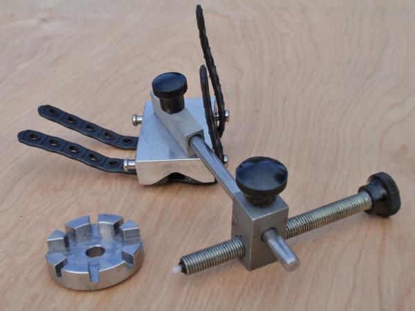 The aluminum v-block on Simple Pleasures' new Quick-True Tool attaches to nearly any frame or fork tube while the adjustable nylon-tipped gage offers a visual reference for truing wheel, chainrings or rotors. Production versions will be anodized with laser-etched graphics.