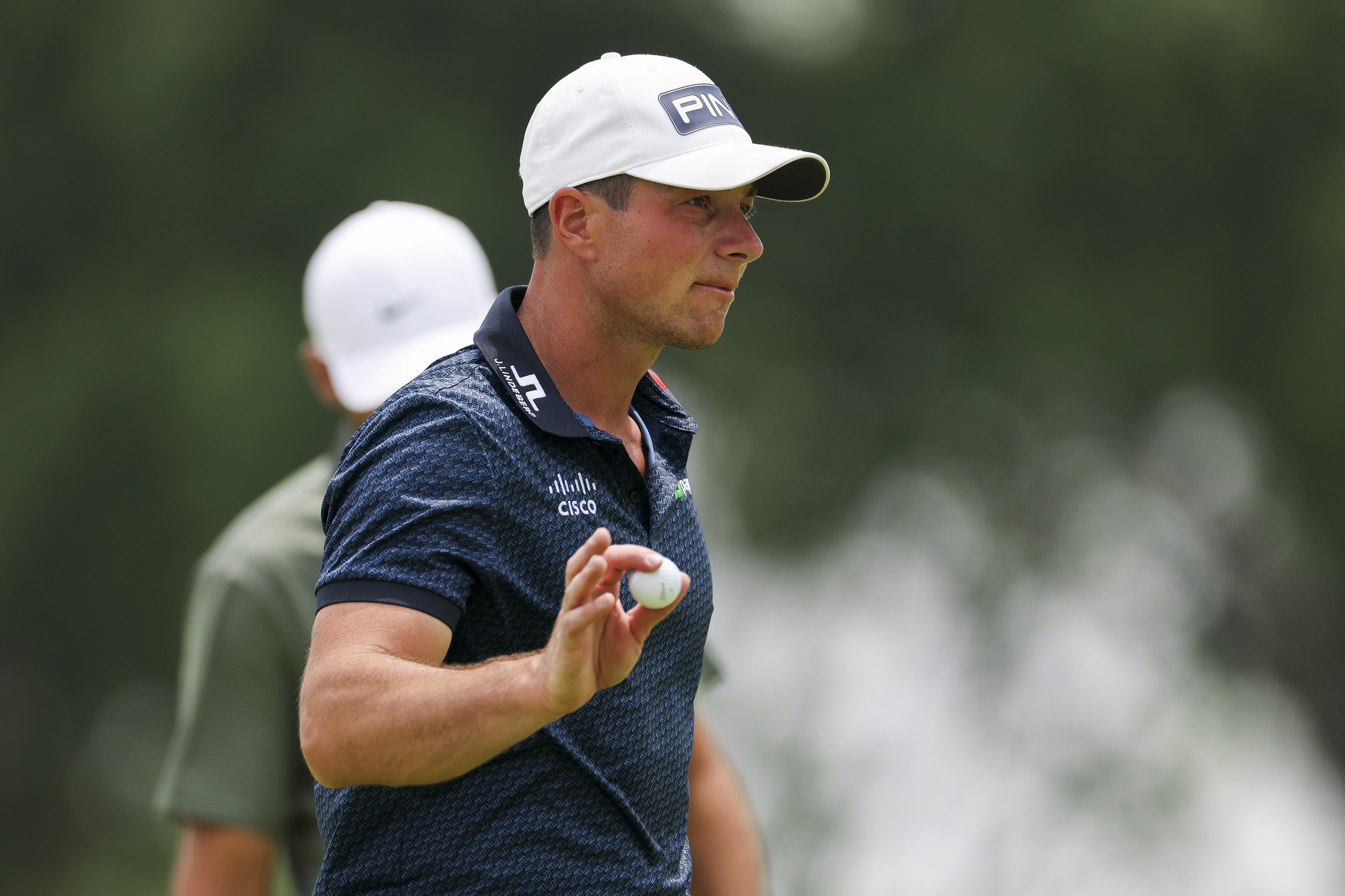 Viktor Hovland waves to the crowd