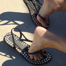 Photo of studded black embellished sandals by Gimaguas and Havaianas.