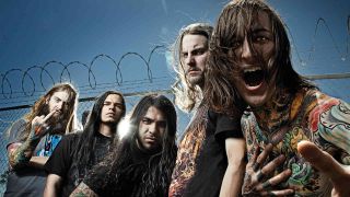 Suicide Silence against a chain link fence in 2009