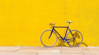 bike in front of yellow background