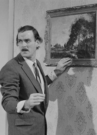 John Cleese as Basil Fawlty.