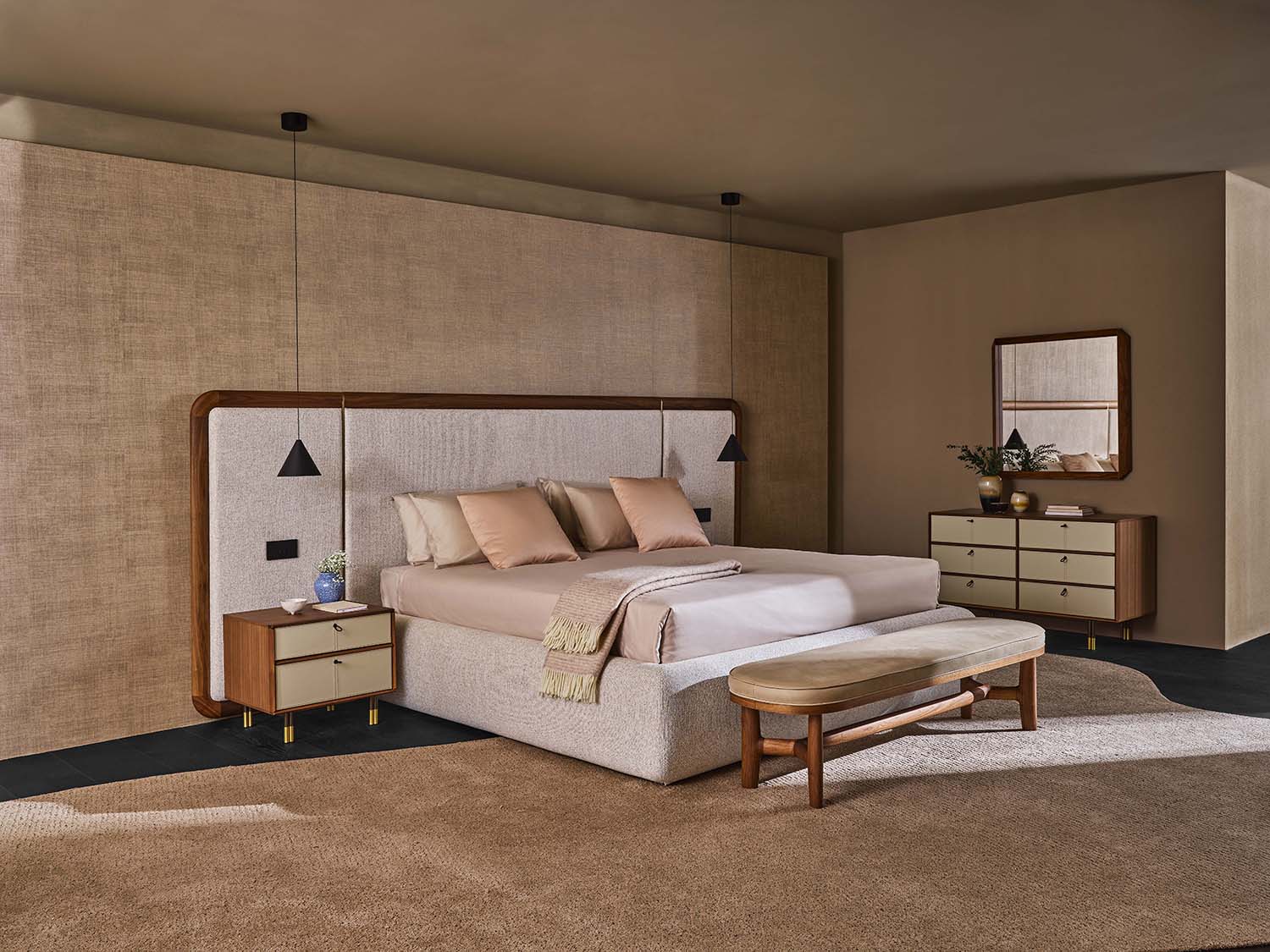 large white bed in beige bedroom with beige walls and carpet