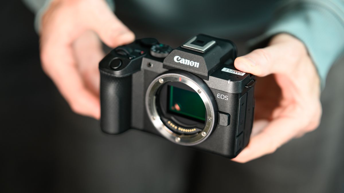 Canon EOS R8 Mark II camera in the hand, no lens attached