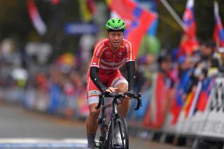 Denmark's Michael Valgren crosses the finish line of the elite men's road race, and would soon be able to celebrate his teammate Mads Pedersen's win at the 2019 World Championships