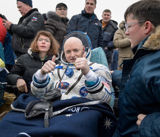 NASA astronaut Scott Kelly gives two thumbs up while resting up from a 340-day mission to the International Space Station. Kelly and two Russian crewmates landed their Soyuz capsule in a remote area of Kazakhstan on March 2, 2016 (Kazakh time).