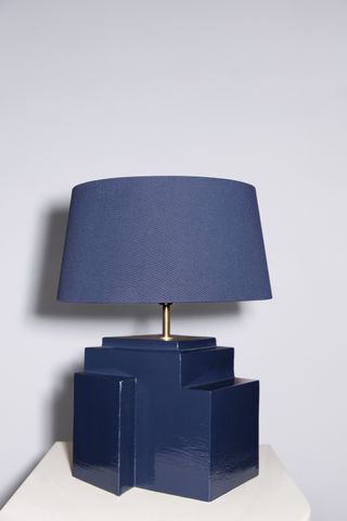 Lamp with a blue geometric ceramic base and a conical lampshade