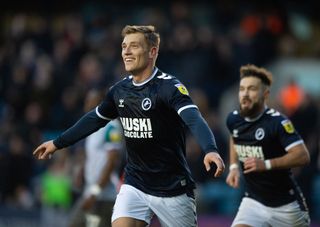Zian Flemming celebrates scoring Millwall's first goal during the Sky Bet Championship match between Millwall and Wigan Athletic at The Den on December 10, 2022 in London, England.