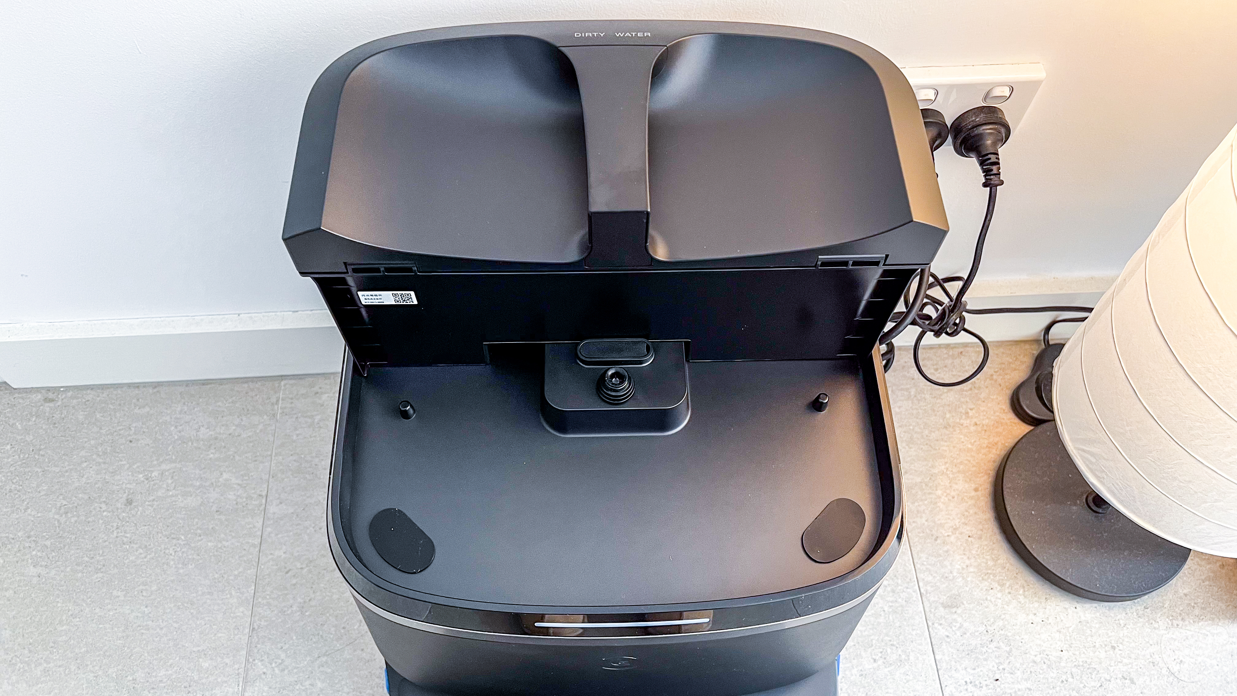 The dirty-water tank on the Ecovacs Deebot T30 Omni clean station with space for the clean-water tank