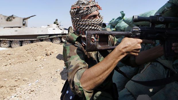 Iraqi Kurdish forces take position as they fight jihadist militants