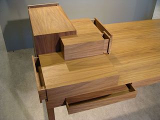 Wooden desk with drawers all facing in different directions