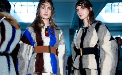 Female models dressed in the Marni A/W 2014 backstage of the fashion show