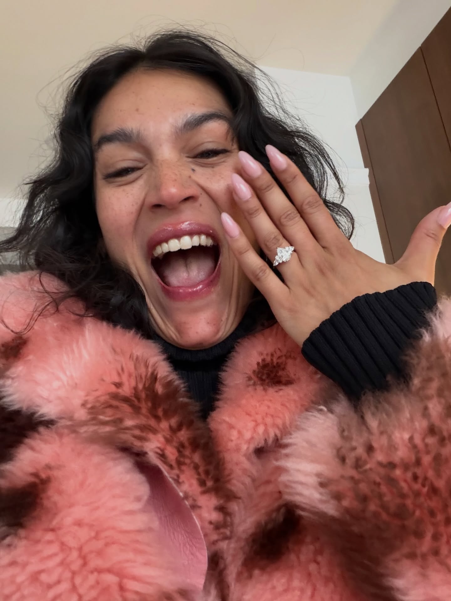Jennifer Atilemile showing off her engagement ring.