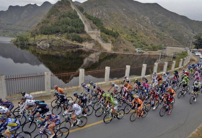 The peloton pass the Great Wall of China during the Tour of Beijing