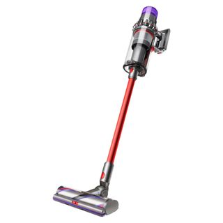 A Dyson Outsize cordless vacuum in Nickel/Red