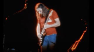 David Gilmour performs onstage with Pink Floyd at Ivor Wynne Stadium in Hamilton, Ontario, Canada on June 28, 1975