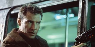 Deckard with a gun in Blade Runner