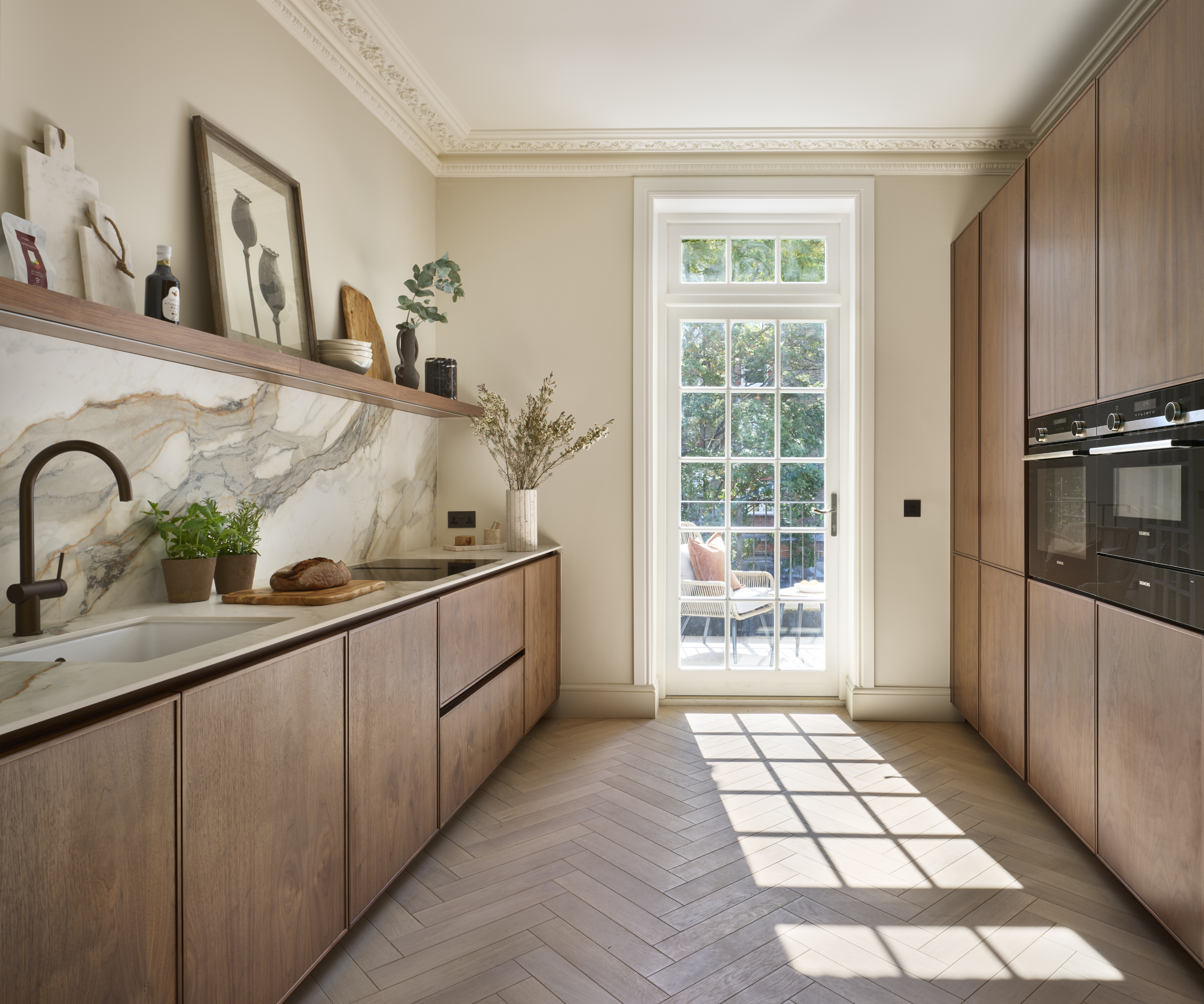kitchen with wooden cabinets, herringbone flooring and open wooden shelving