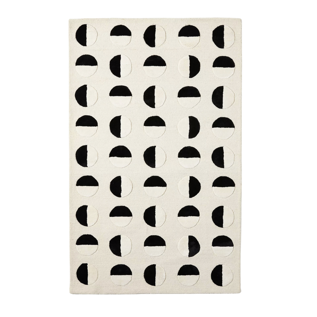 white rug with black circles on it