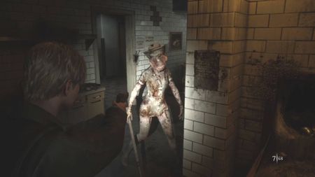 Silent Hill 2 remake screenshot of James Sunderland facing a Bubblehead Nurse in the hospital sequence of the game.