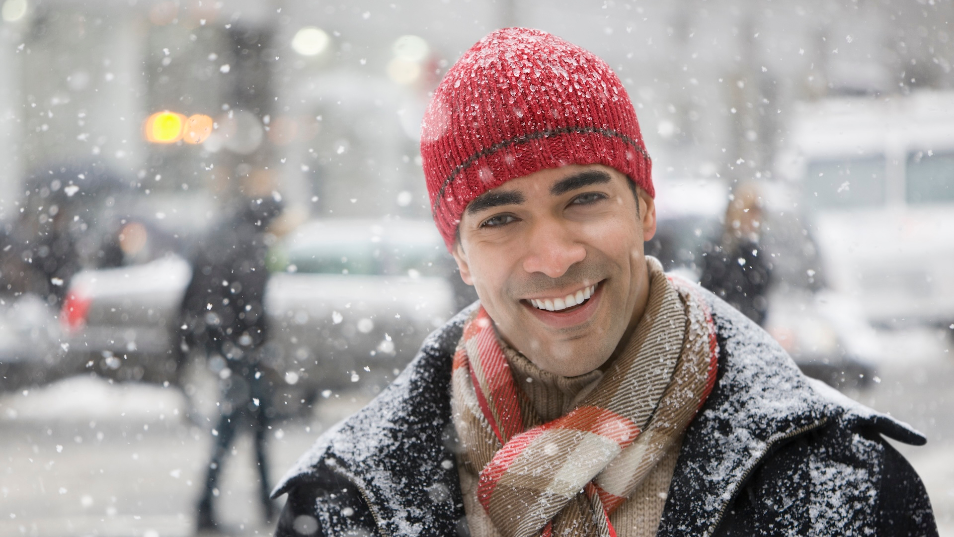 Man enjoying snow in city