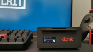 A RFIDisk with a floppy disk inside, loading Slay the Spire on Steam