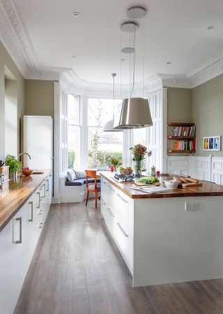 With its clean white design and lush garden backdrop, Catie Wearmouth's kitchen is a haven for family living