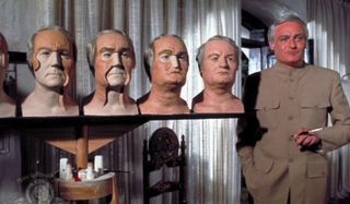 Diamonds Are Forever Blofeld stands in front of his plastic surgery model