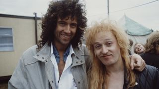 Brian May with Bad News' Vim Fuego in 1986