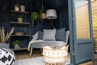 garden room summer house with blue painted interior and seating