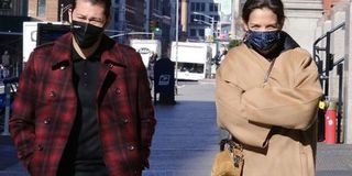 Katie Holmes wearing a statement camel coat while walking with Emilio Vitolo, Jr