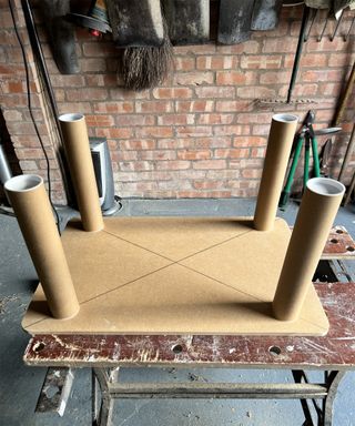 home made wooden and cardboard tube table