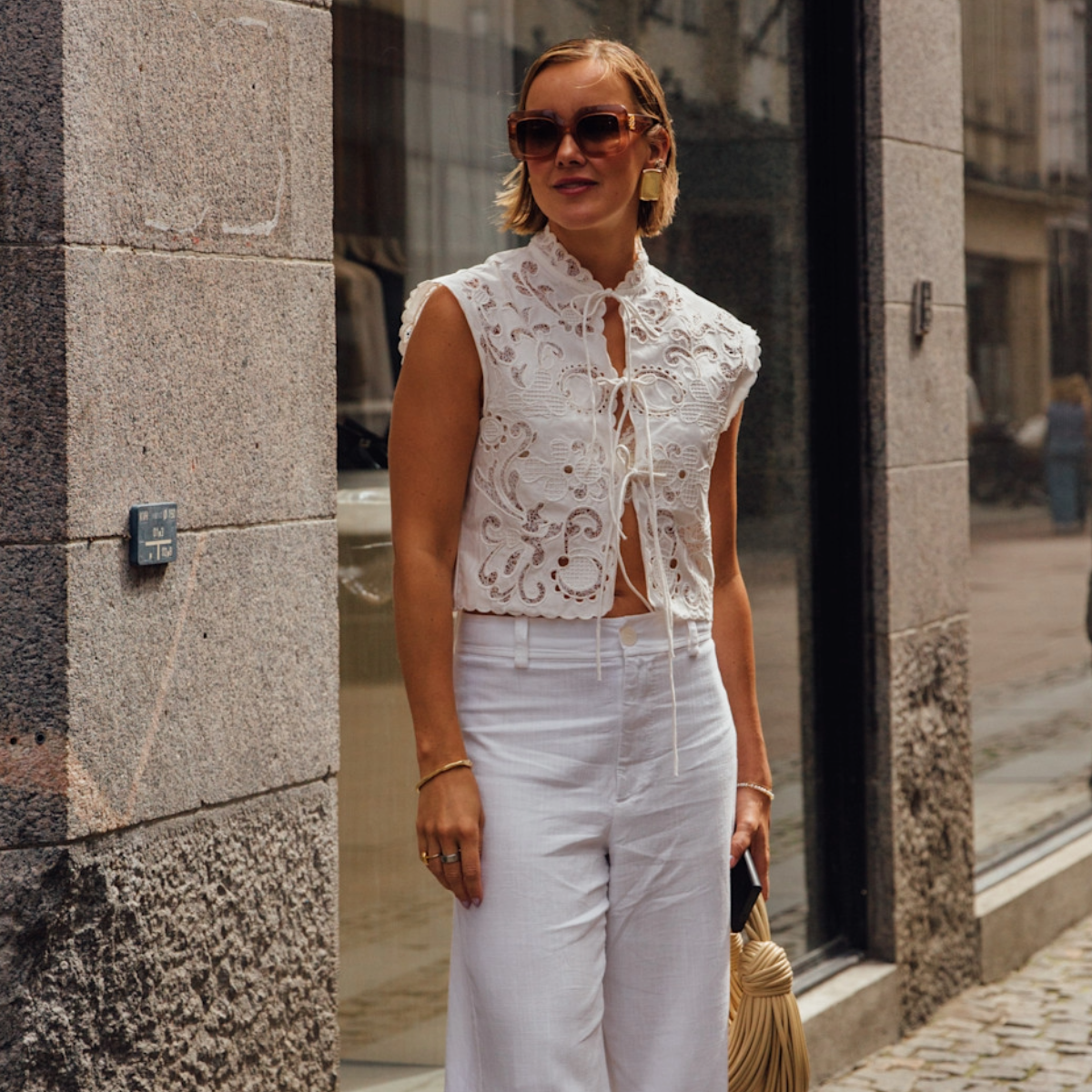 woman wearing a white matching set in Copenhagen