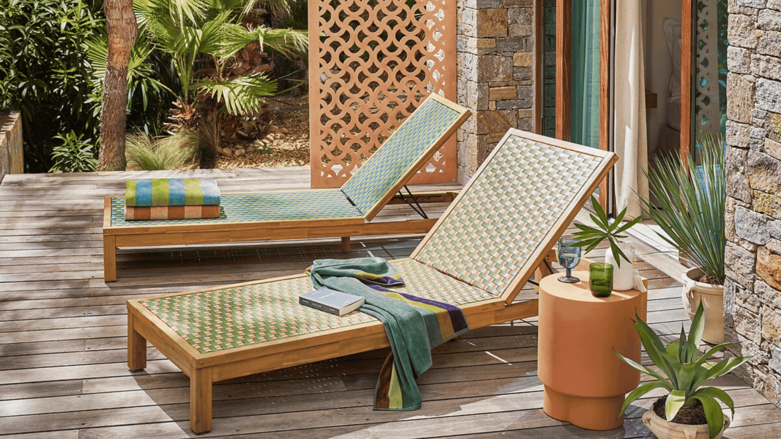 GIF of three rotating images that showcase outdoor furniture for 2026 in different landscapes. There is one showing a colorful lounger, one with a seating arrangement in front of the sea, and one with a sofa in a garden.