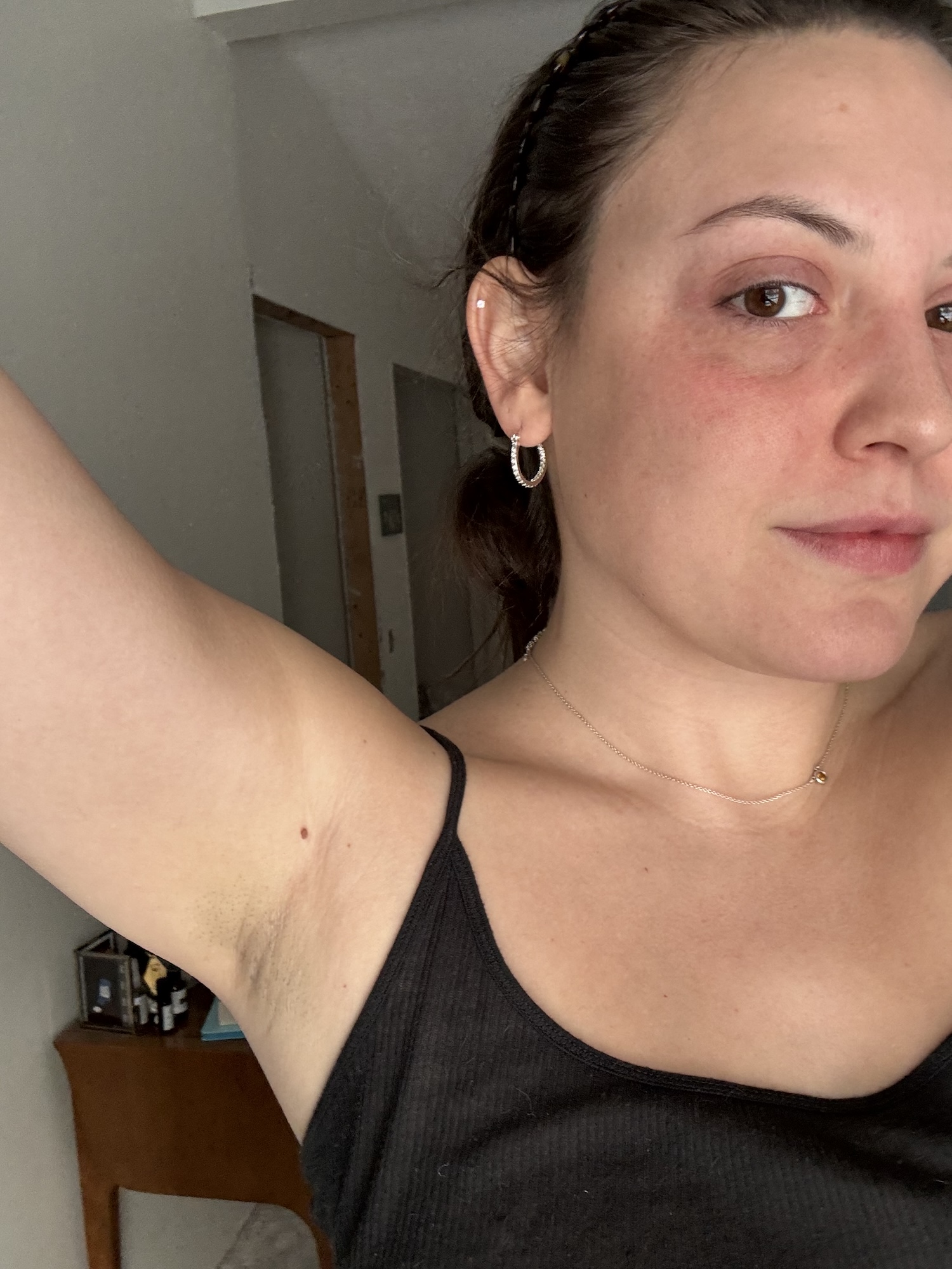 Sophia Vilensky shows off her nice-smelling armpit after a long day made better by AKT's natural deodorant.