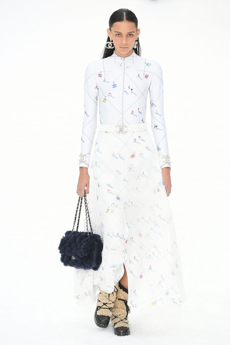 White, Clothing, Fashion model, Fashion, Runway, Sleeve, Dress, Neck, Fashion show, Beige,