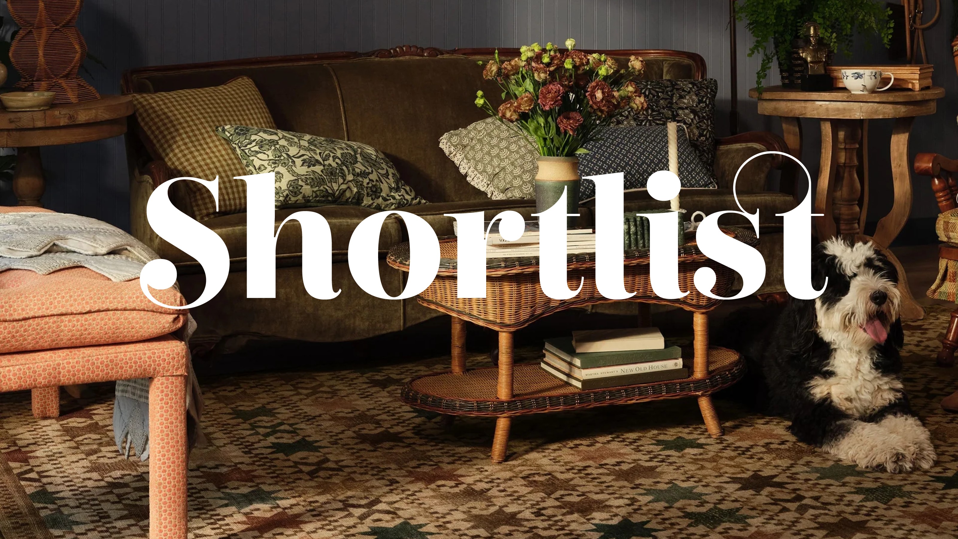 A living room with a gallery wall, a green velvet sofa and the Ruggable Calloway brown multicolour rug on the floor