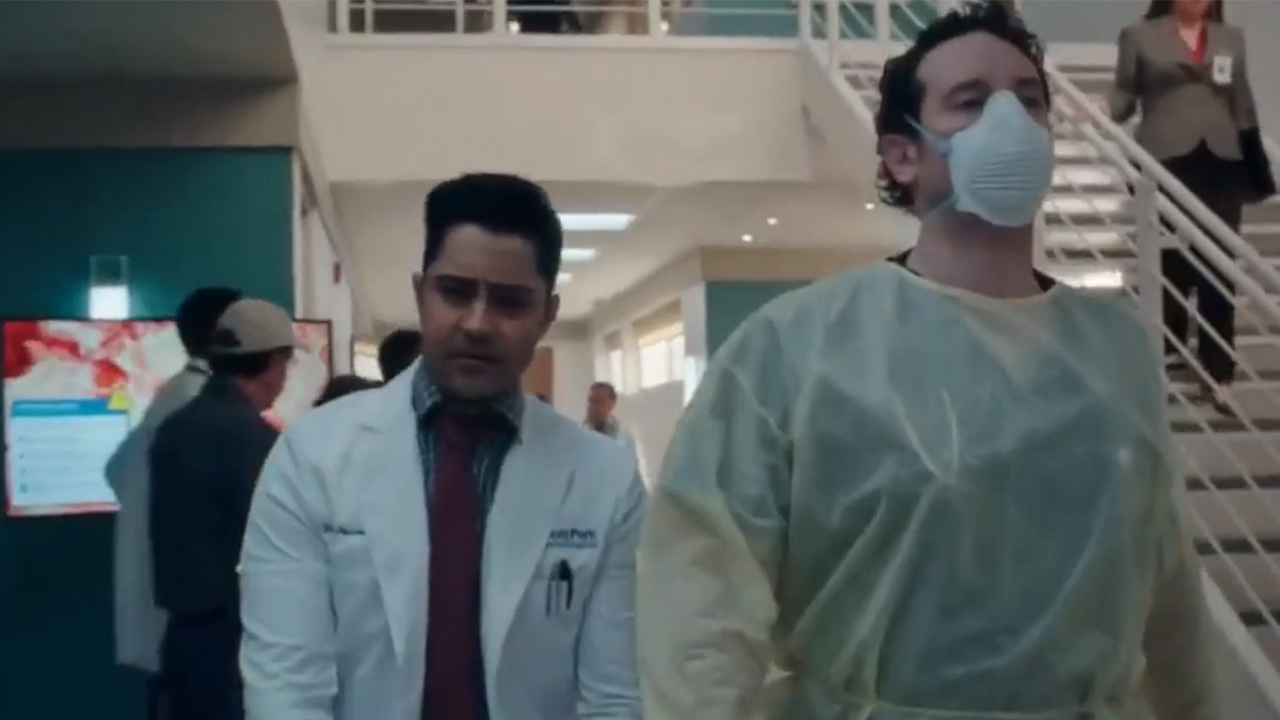 Two doctors walking in a hospital in The Resident.