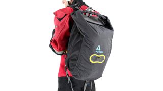 man wearing Aquapac 25 litre Wet & Dry backpack