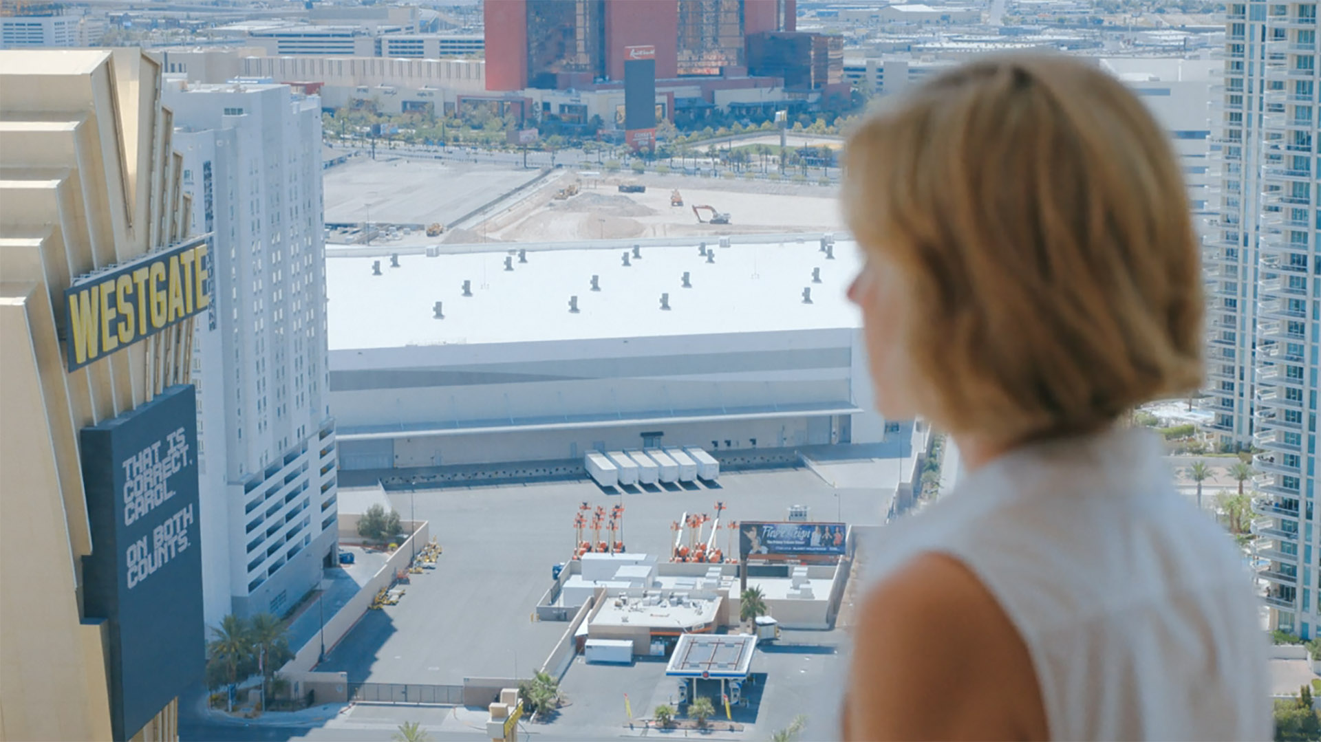 Carol looking at a message from The Others on the Westgate hotel in Pluribus episode 5