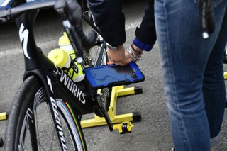 An official uses a device to test for mechanical doping prior to the start of the 2375 km fourth stage of the 103rd edition of the Tour de France cycling race on July 5 2016 between Saumur and LimogesThe new magnetic tablet testing device used in professional cycling since January can detect any form of mechanical doping the Union Cycliste Internationale UCI said on May 3 2016 AFP jeff pachoud Photo credit should read JEFF PACHOUDAFP via Getty Images