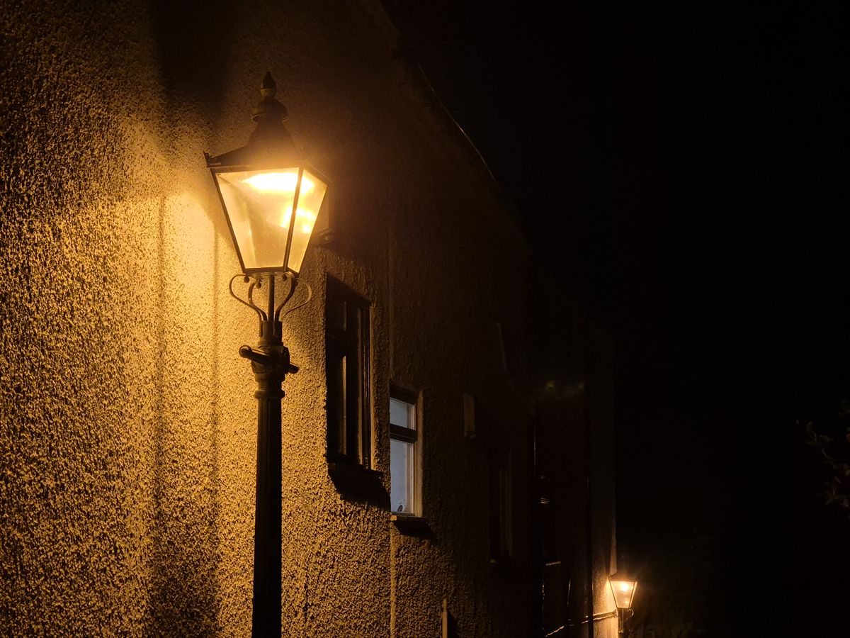 Street lamp lit up at night