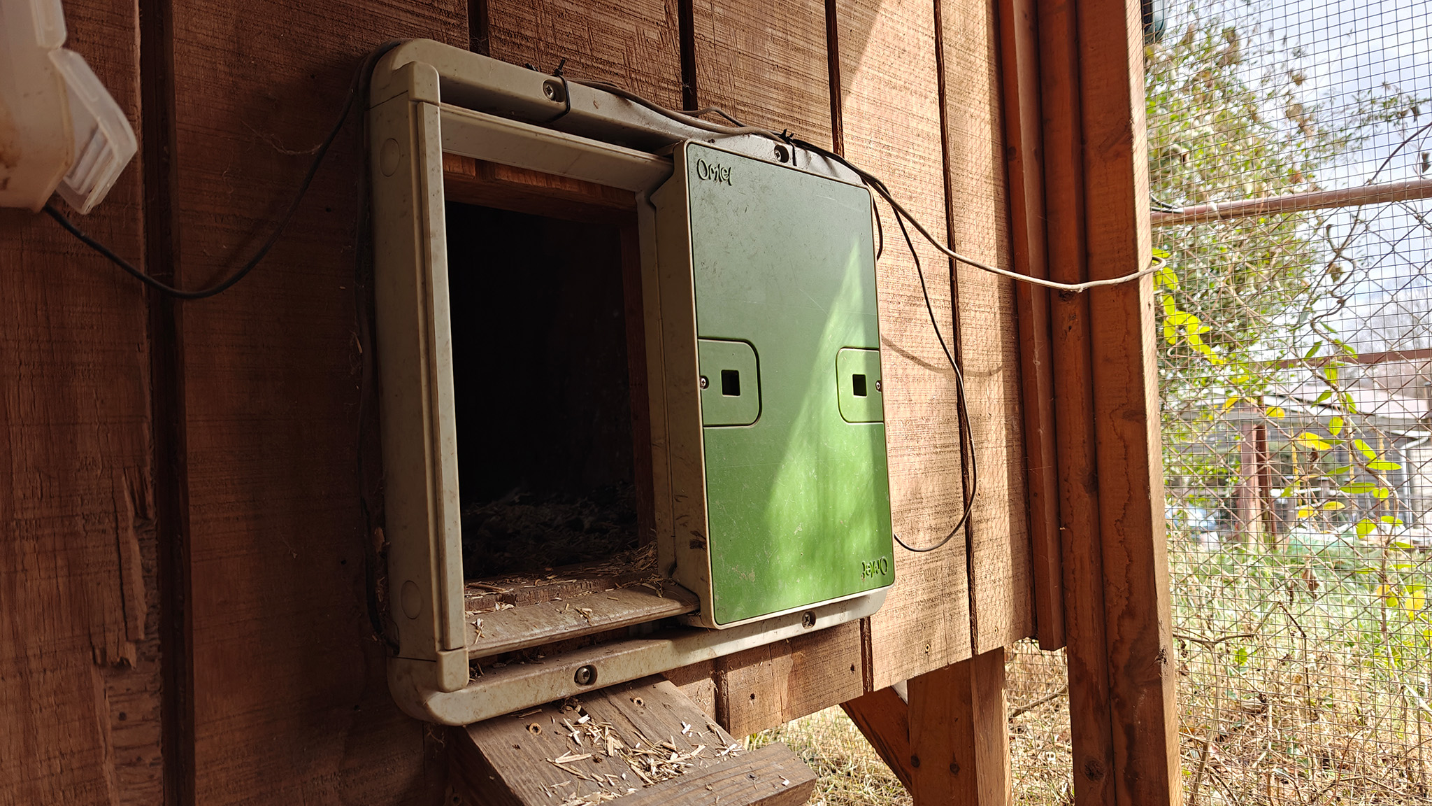 An Omlet Automatic Chicken Coop Door in the open position