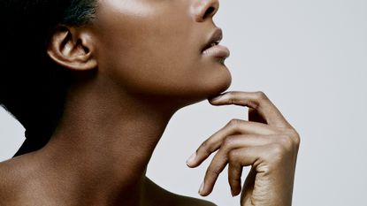 woman with beautiful skin looks to the side
