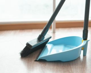 A broom and dust pan