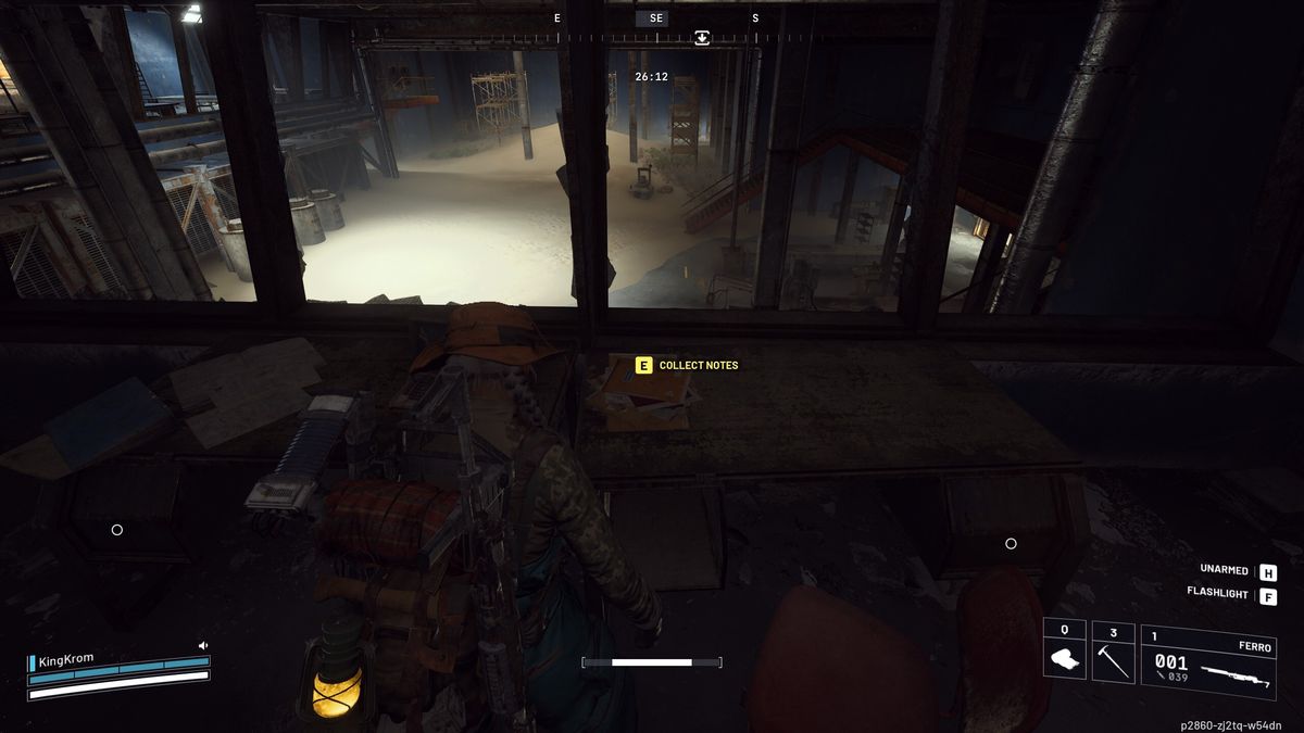 Arc Raiders Lay of the Land: A player looking at the shipping notes on a desk overlooking a dark warehouse.