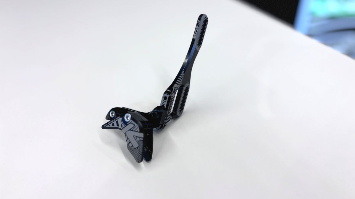 Close up of a K-Edge bottle-cage-mounted chain guide