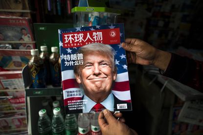 A copy of the local Chinese magazine Global People with a cover story about President Donald Trump.