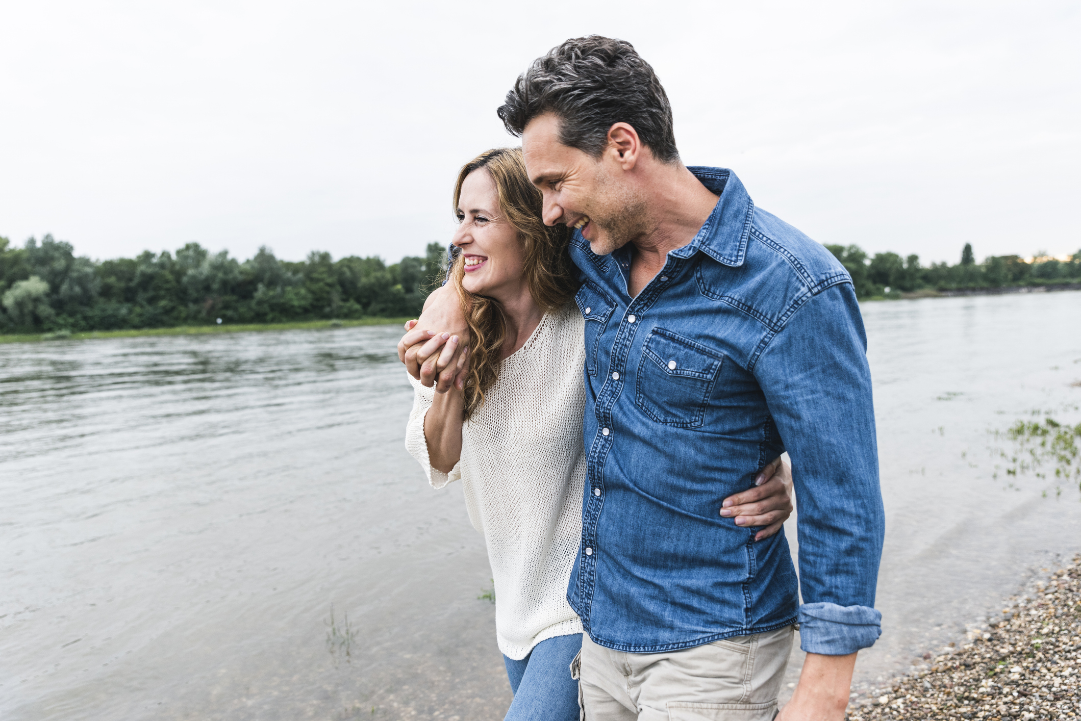 Couple walking by the water