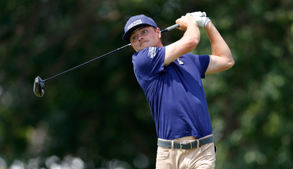 Luke Clanton hits a driver and watches the tee shot